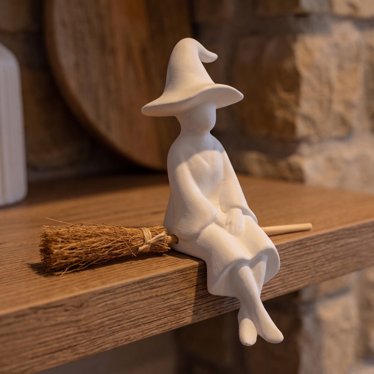 Shelf-Sitting Ceramic Witch with Broom – close-up detail