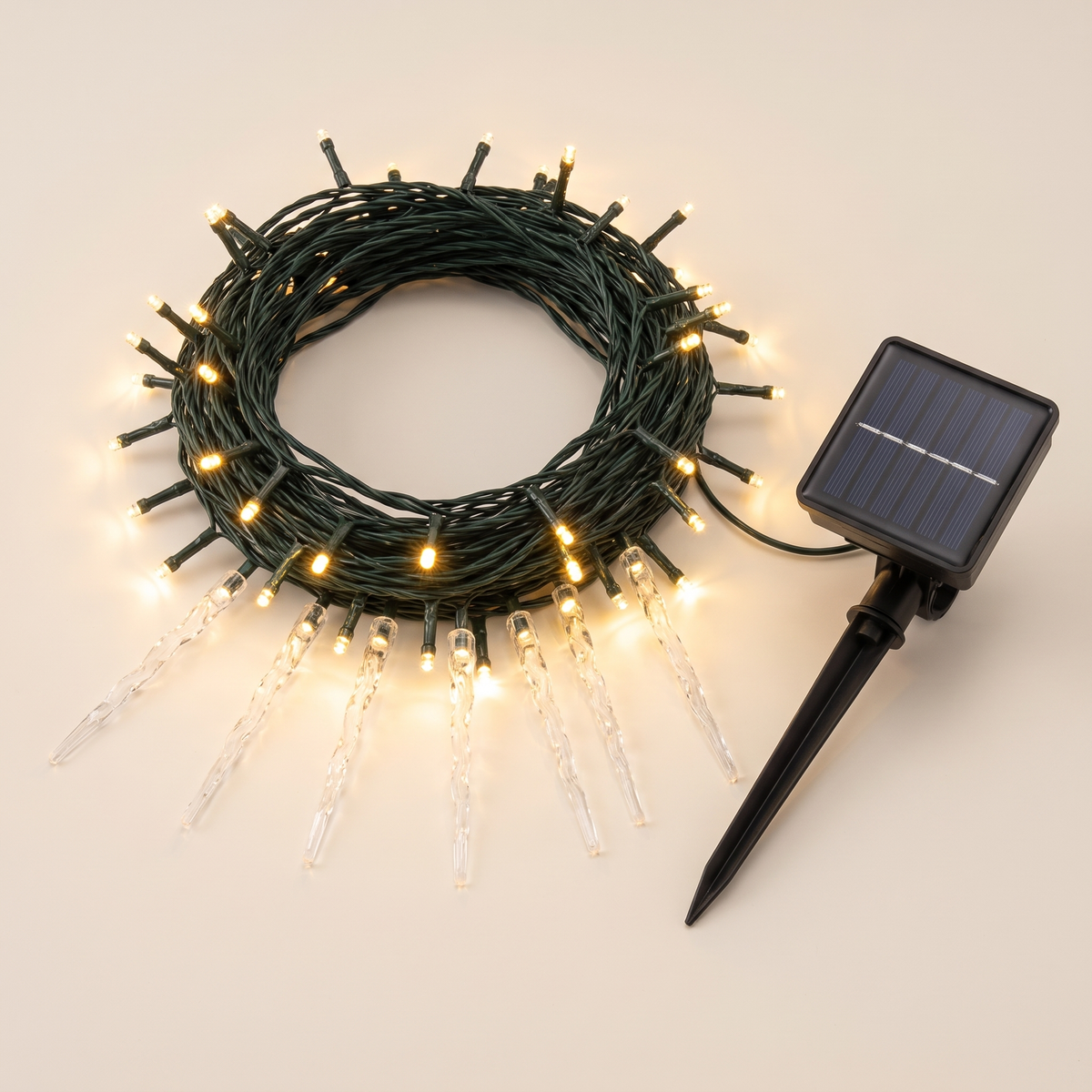Warm White Solar LED Icicle Christmas Lights – 12.5m – studio view with solar panel