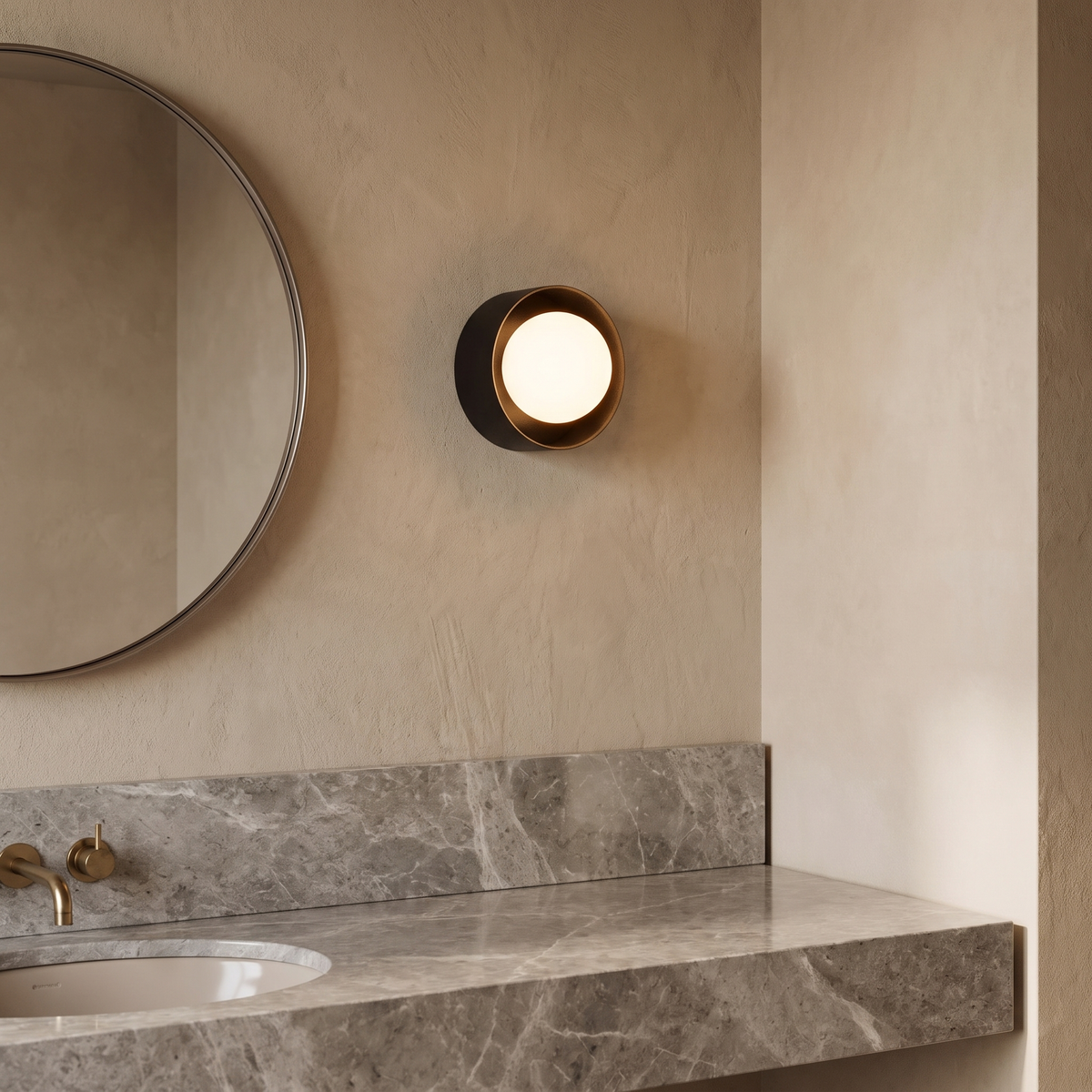 Orb Framed Glass Wall Light – Iron – styled in a room