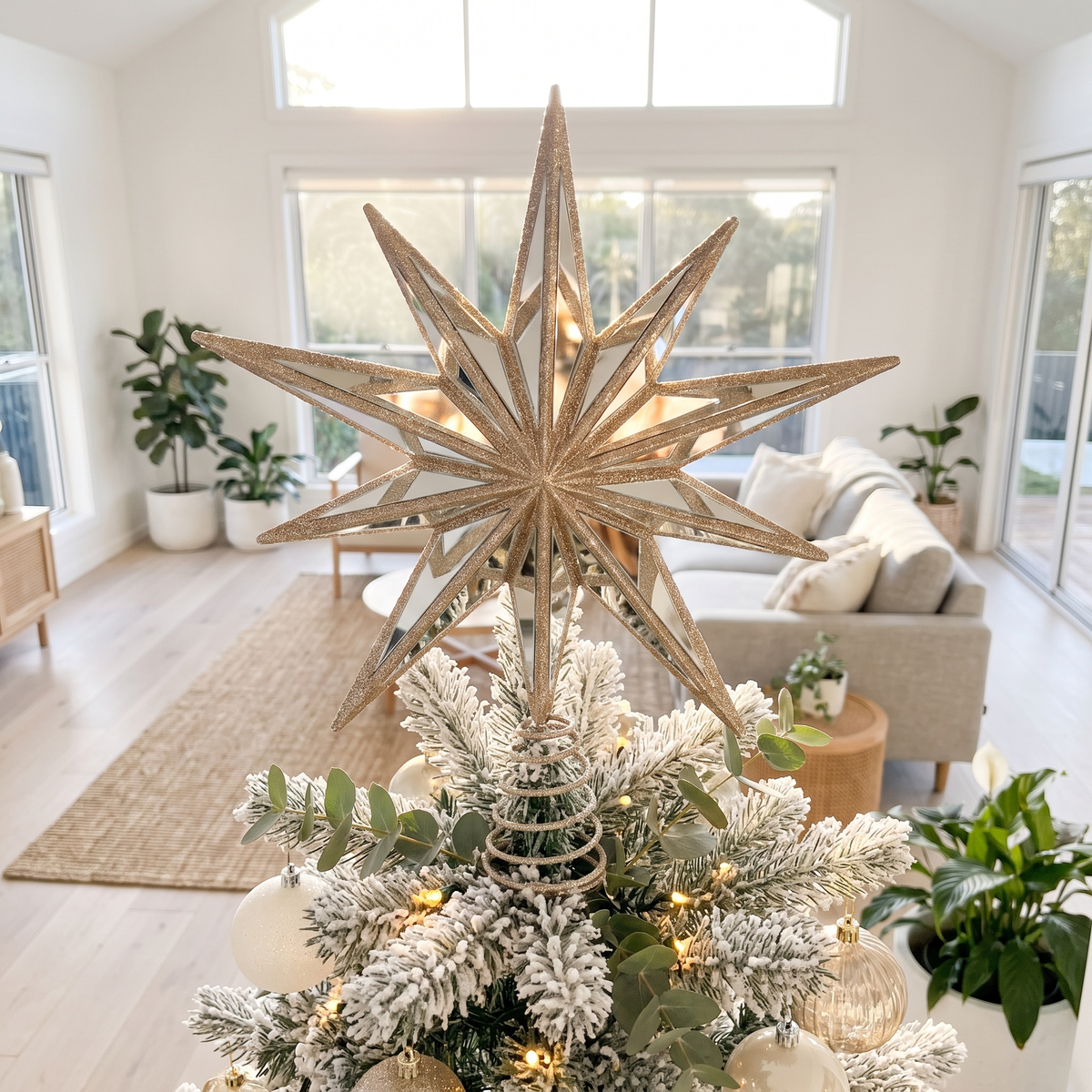 Champagne Mirrored 9-Point Star Tree Topper – 31cm – styled in a room