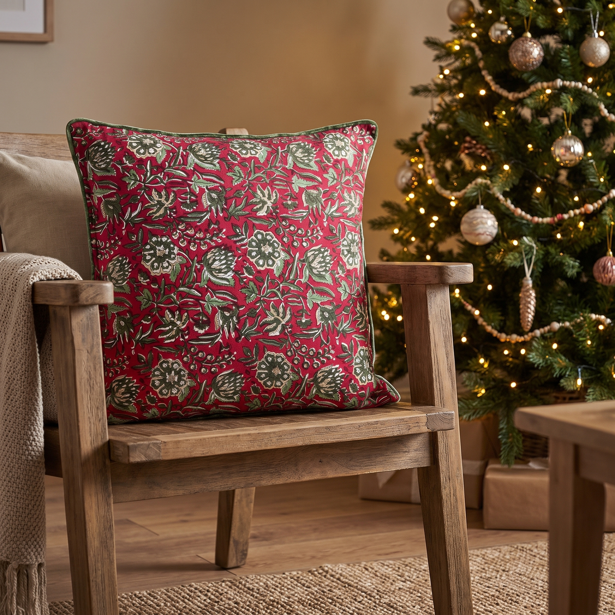 Block-Printed Red Rose Christmas Cushion Cover – 50cm – styled in a room