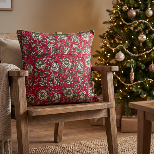 Block-Printed Red Rose Christmas Cushion Cover – 50cm – styled in a room