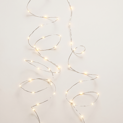 Warm White Twinkle Micro LED Lights on Silver Wire – 100 LED, 4.9m – studio view