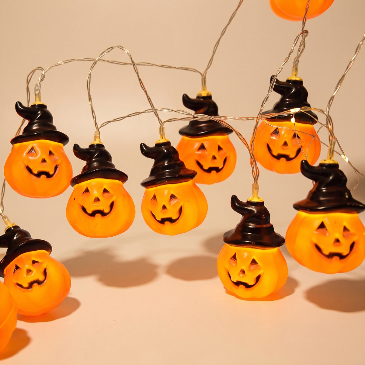 Warm White Pumpkin String Lights – 5m, 20 LED Battery Halloween Lights – studio view