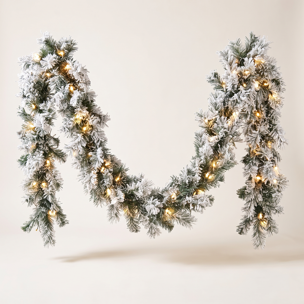 Pre-Lit Snow-Flocked Spruce Christmas Garland – 2.7m – studio view