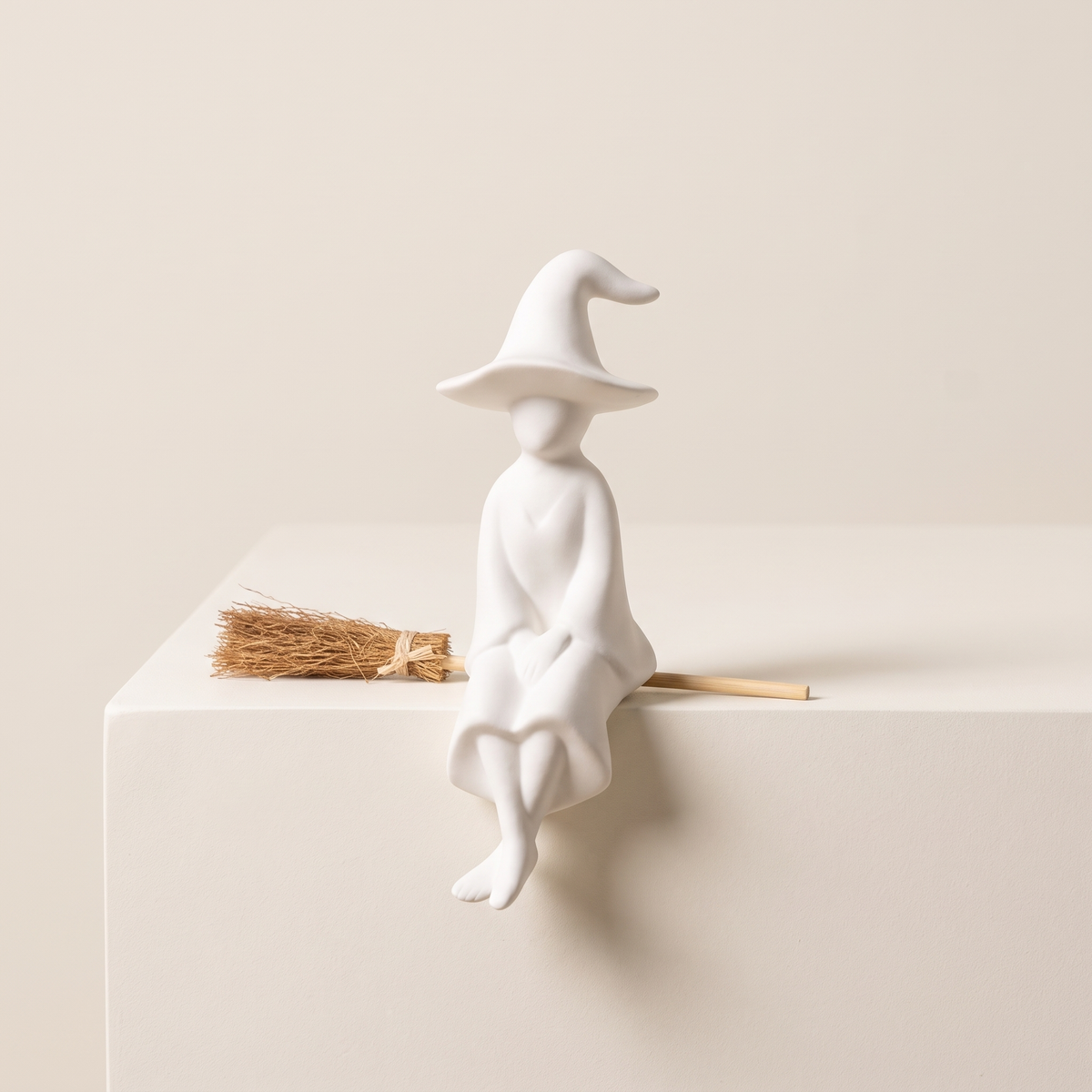 Shelf-Sitting Ceramic Witch with Broom – studio view