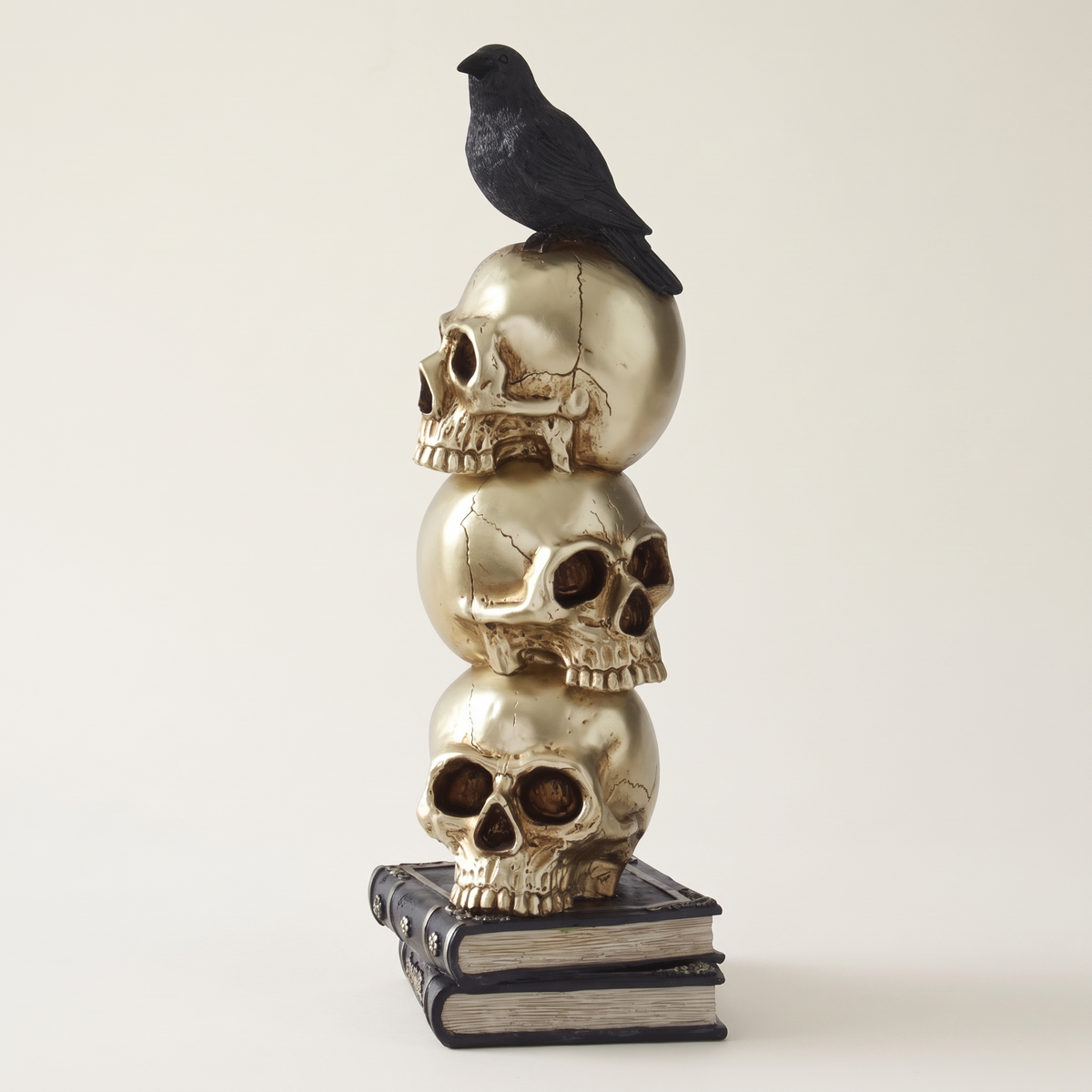 Gold Stacked Skulls & Crow Figurine – 41cm Gothic Resin Sculpture – studio view