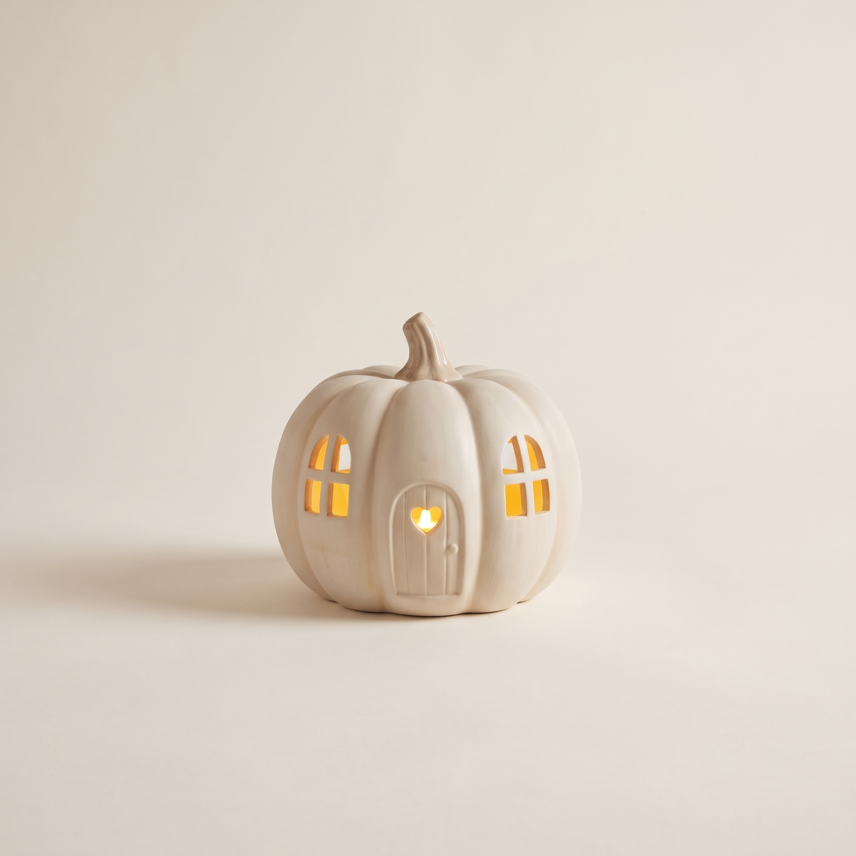 LED Ceramic Pumpkin House with Heart Door – Off-White Halloween Decor – studio view