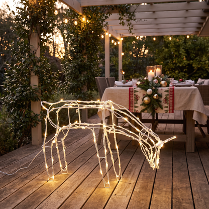 Solar LED Standing Reindeer Christmas Decoration – 60cm – glowing on a backyard deck at dusk