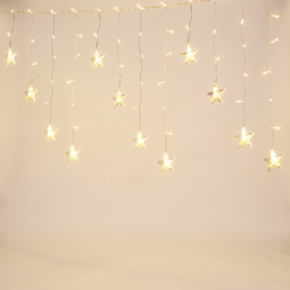 Warm White Star Icicle Christmas Lights – 6m, 160 LED, Solar or Plug – studio view