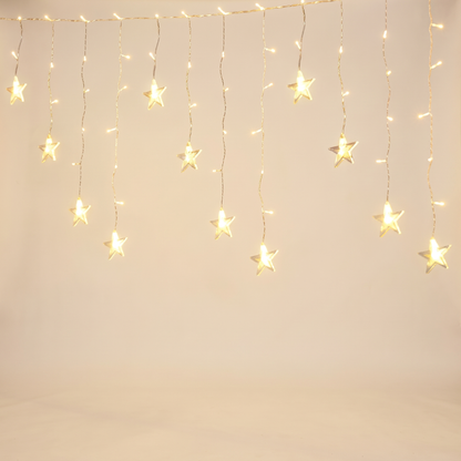 Warm White Star Icicle Christmas Lights – 6m, 160 LED, Solar or Plug – studio view
