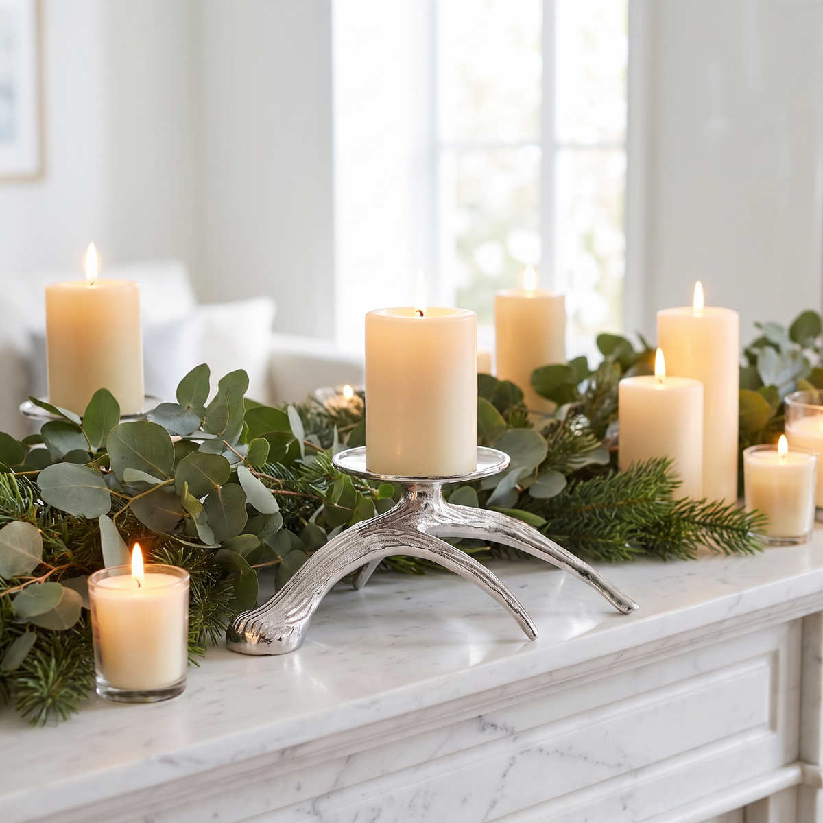 Silver Antler Horn Metal Candle Holder – on a white marble mantelpiece