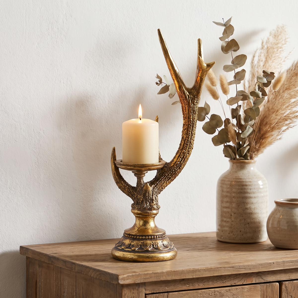 Antique Gold Stag Antler Pillar Candle Holder – 42cm – on a styled sideboard