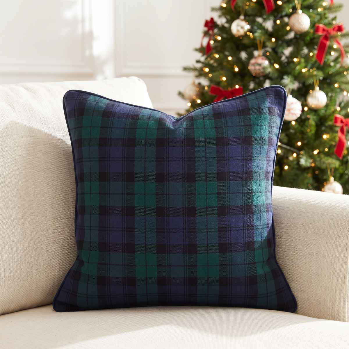 Blue & Green Tartan Christmas Cushion Cover – 50cm, Piped – on a cream linen sofa