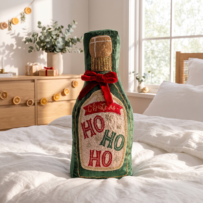 Green Velvet Champagne Bottle Christmas Cushion – 45cm, Beaded – styled on a white bed