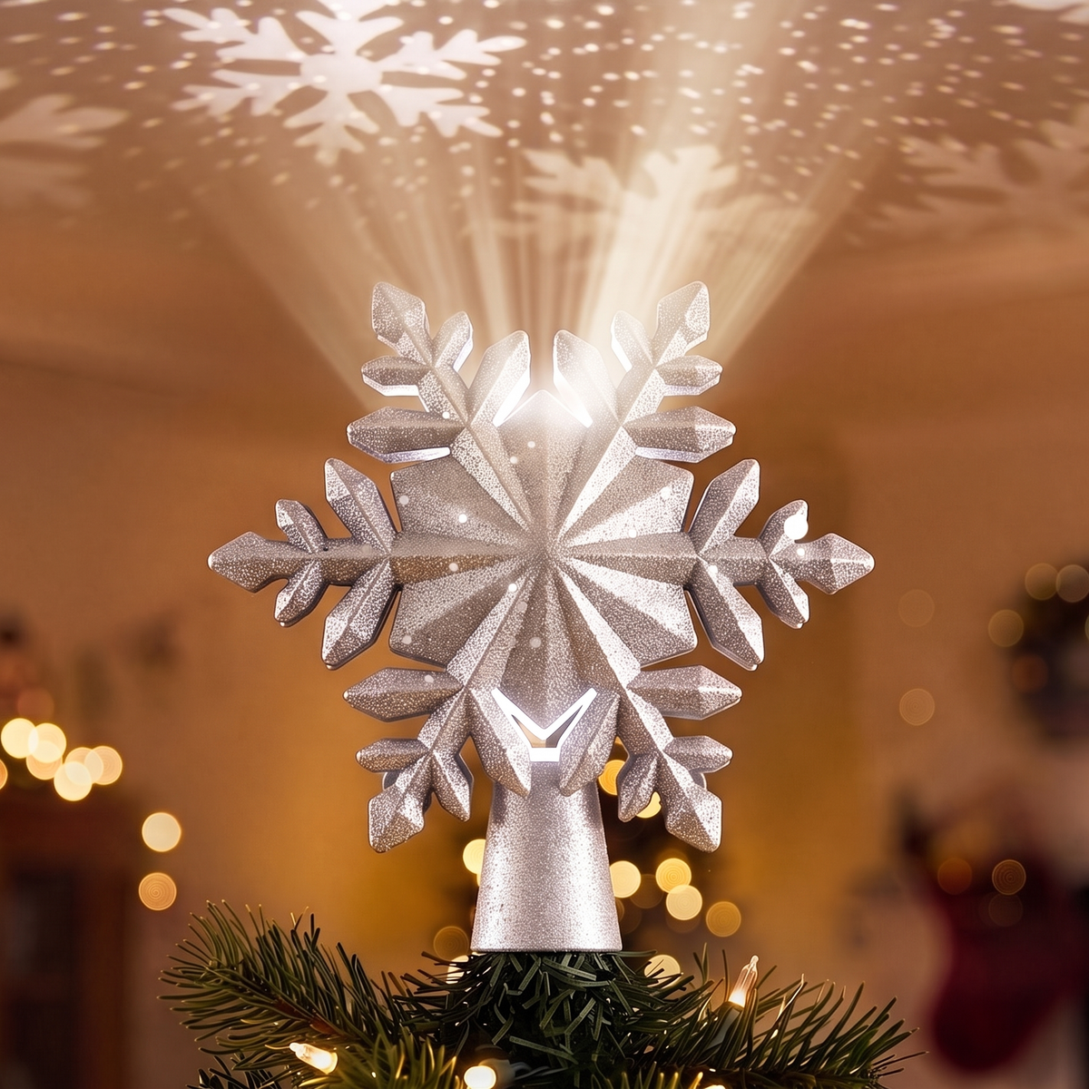 Silver Snowflake Projector Christmas Tree Topper – 23cm – close-up of the silver glitter snowflake