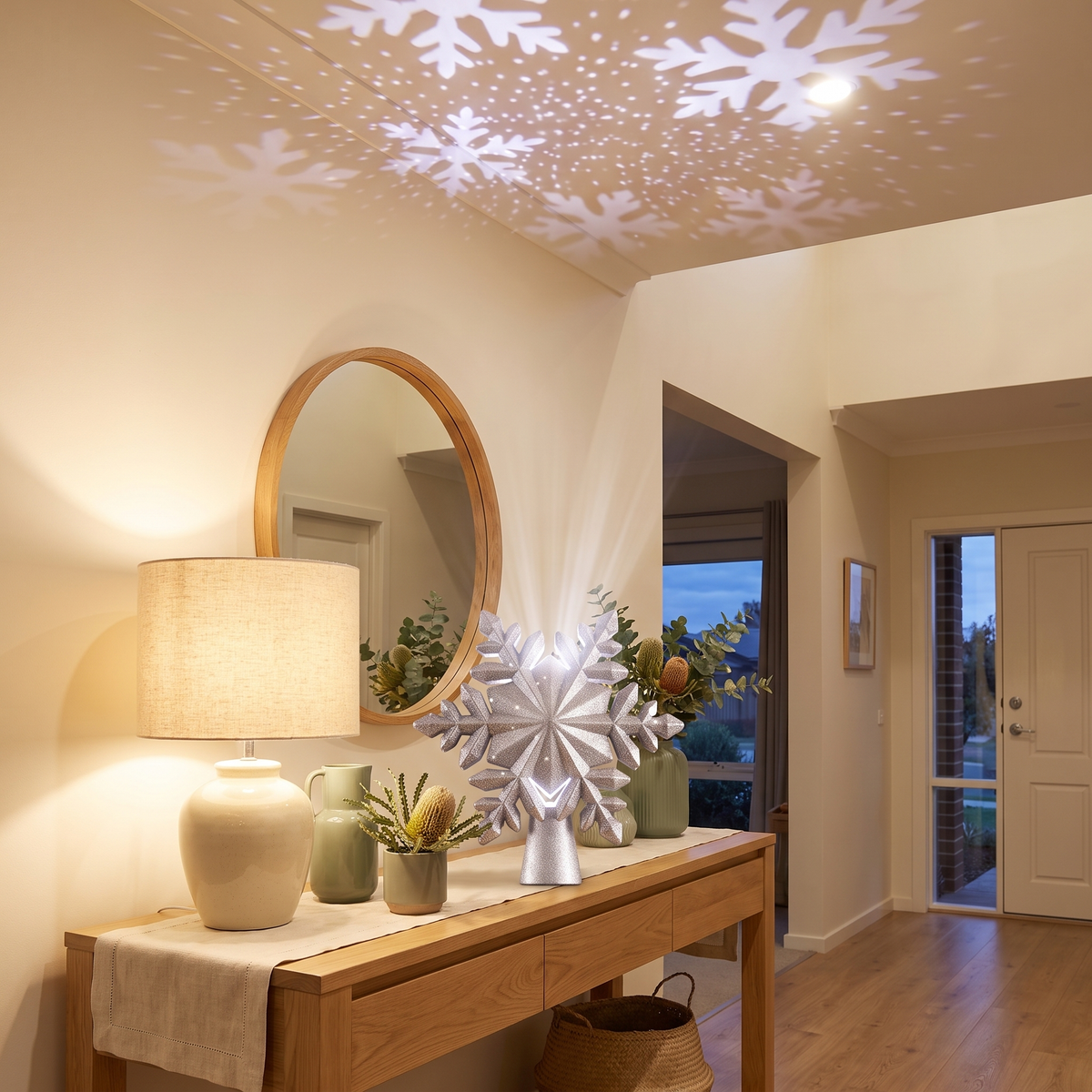 Silver Snowflake Projector Christmas Tree Topper – 23cm – projecting snowflakes in a styled entryway